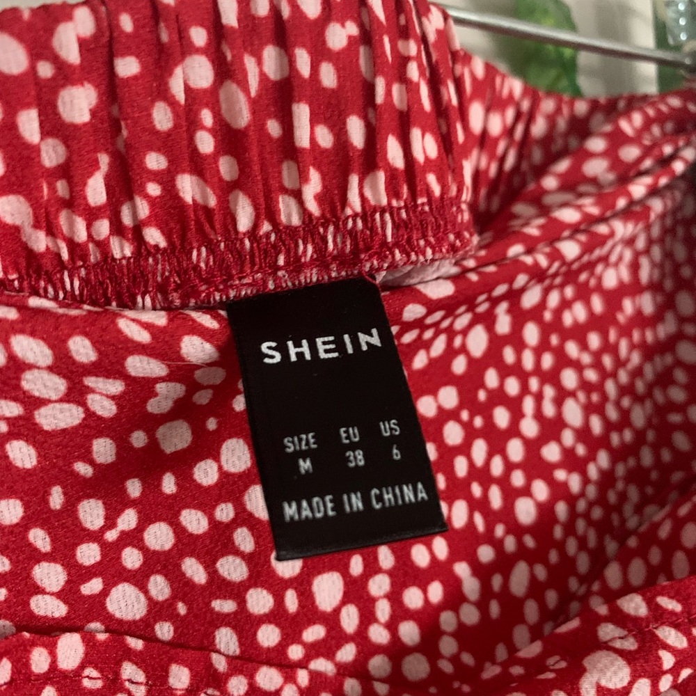 SHEIN wrap around red and black spotted skirt